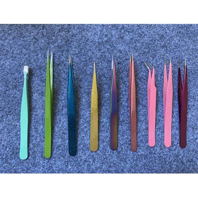 China Comfortable handle factory price customized pink stainless steel wick volume mounted gold tweezers for sale