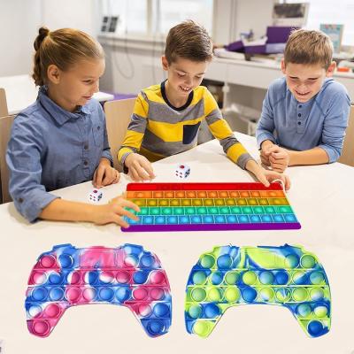 China Big Size Silicone Toy Makers Silicone Keyboard Push Noise Pushing Person Sensory Toy for sale