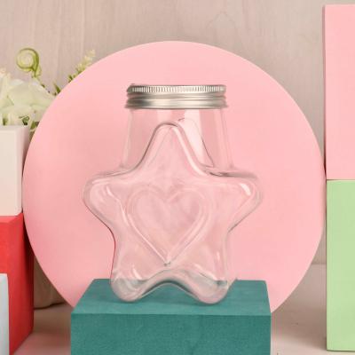 China Household products sell well new type unique design hot sale candy bottle star bottle star pentagon bottle Te koop