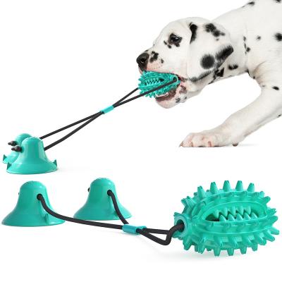 China Newly Designed Stocked Heavy Duty Natural Rubber Chew Traction Training Teeth Grinding Sucker Fixed Ball Dog Pet Toy for sale