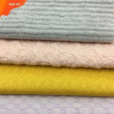 China Anti Pill Polyester Spandex Jacquard Ball Solid Dyed Knitting Fabric For Women Clothes for sale