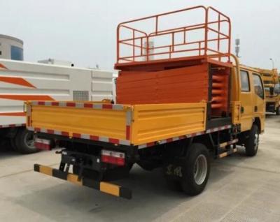 Chine 9 mètres de couleur d'ascenseur de ciseaux monté par camion orange avec la capacité de chargement 300Kg à vendre