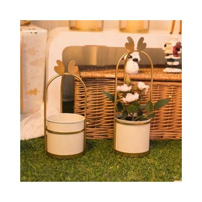 China Modern Gold Metal Planter With Stand For Decoration Christmas Festival Home Decor Customized Flower Pots Set for sale