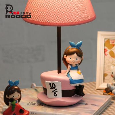 China Art Decor ROOGO Resin Kawaii GIirl statue base decorative bedside table lamps with pink fabric lampshade for sale