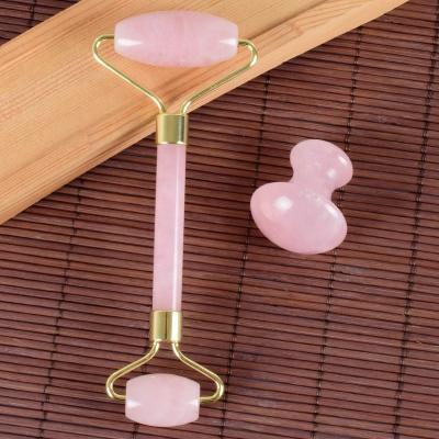 China Hot Natural Jade Roller And Gua Sha Stone Roller 100% Rose Quartz Roller Facial Beauty Rose Amazon Sales Body Neck Eye Face Massager for sale