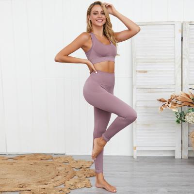 China Antibacterial Custom Workout Yoga Sets Clothes Seamless Fitness Yoga Leggings Gym Tights And Sports Bra Set For Women for sale