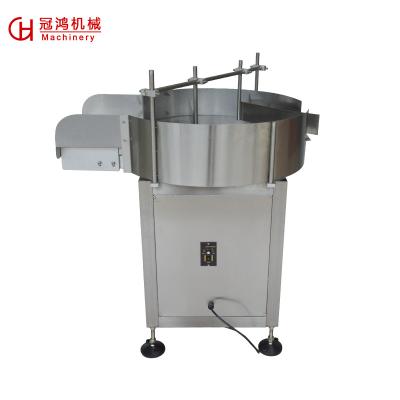 China Wooden Case Commodity Rotary Bottle Feeding Turntable Unscrambler Collecting Machine for sale