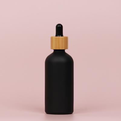 China 5Ml 15Ml 30Ml 50Ml 100Ml Clear Amber Pink Glass Essential Oil Refillable Black Dropper Bottles With Bamboo Lid, Bamboo Oil Bottle for sale