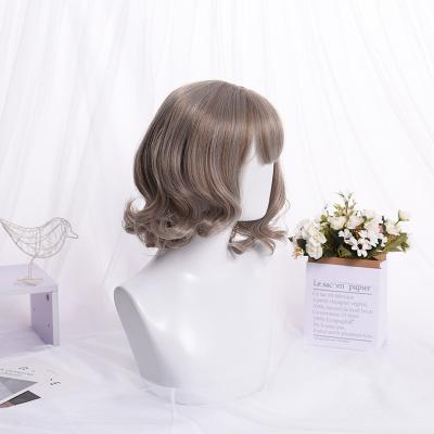 China Daily Use Women's Comfortable Natural Curly Pixie Curly Short Fluffy Wigs Premium Synthetic Wigs With Bangs for sale