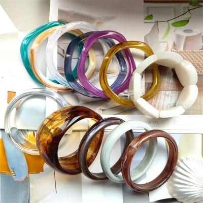 China Colorful Chunky Curved Stacking Clear Acrylic Tube Religious Bracelets Bangles Gift For Women for sale