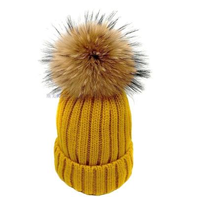 China COMMON Winter Hats For Women Knitted Real Raccoon Fur Beanie Ski Hats Solid Warm Winter Hats Women Pom Pom for sale