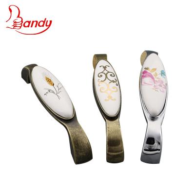 China Traditional Zinc Alloy Ceramic Zamak Leg Bar Rice Ear Pattern Color Customized Pull Handles Use For Buffet Cupboard Wardrobe for sale