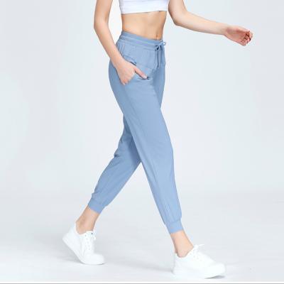 China 2022 New Sports Breathable Casual Pants For Women Loosely Show Feet Skinny Tied Pocket Yoga Running Pants for sale