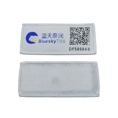 China Long Range Fabric Textile Iso18000-6c Rfid Laundry Tag Washable for sale