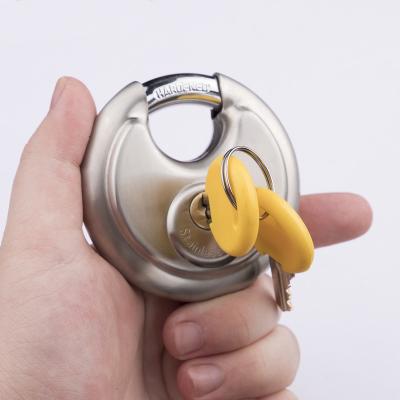 China Heavy Duty Plastic Round Disc Door Locks SS Solid Steel Disc Padlock High 304 1.5 70mm Heavy Duty Plastic Key Padlocks for sale