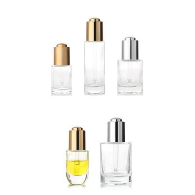 China Cosmetic Push Button Essential Oil Glass Bottle Square Glass Bottle Empty Clear Empty Dropper for sale