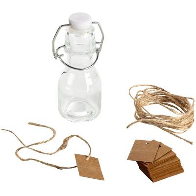 China Freshness Preservation 2oz Mini Swing Top Glass Bottles With Tags And String For Gifts 15pack Clear Glass Bottle for sale