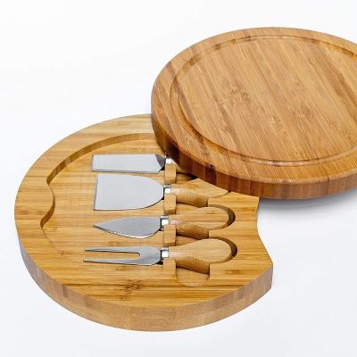 China Viable Wholesale Round Tray Wooden Engraved Knife Set Kitchen Cheese Bamboo Cutting Boards With Mini Knives for sale