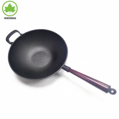 China Sustainable cast iron cookware wok preseasoned with long wooden handle for sale