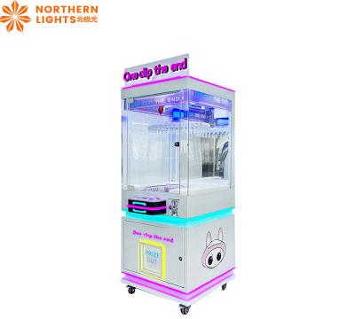 China New Design Clip Doll Machine Mini Gift Doll Catch Game Machine Prize for sale