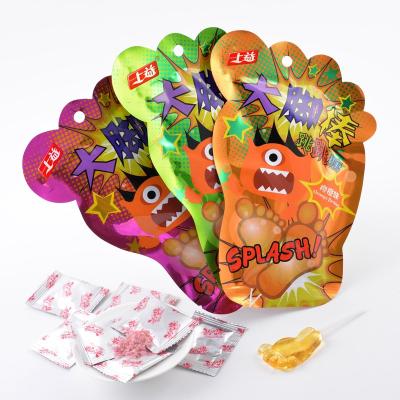 China 14g Natural Foot Shape Lollipop With Magic Poping Candy for sale