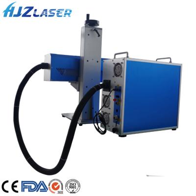 China Laser Marking HJZ 30W CO2 Laser Marking Machine Portable CO2 Laser 50W Marking For Mineral Bottles for sale