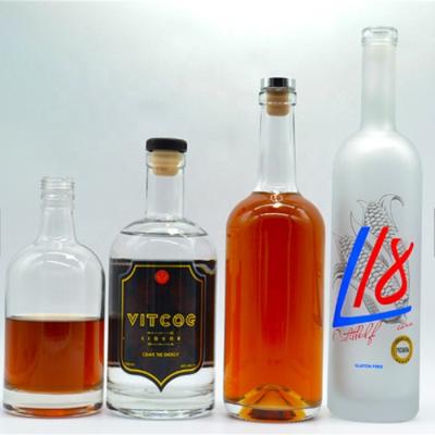 China Premium Long Round Neck Vodka Tequila Vodka Rum Brandy Cork Short Clear Transparent Wisky Glass Bottles for sale