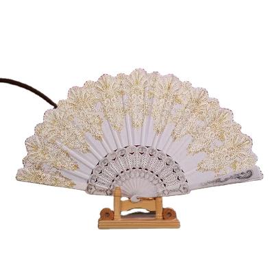 China Factory wholesale handwork wedding gift chinese style retro fabric folding fan gold chinese craft hand held plastic fan for sale