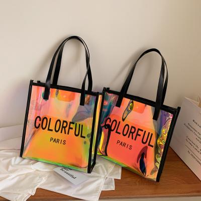 China PVC Bag Gift Package Lady Grocery Bags Laser Handled Colorful Shopping Bag for sale