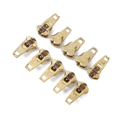 China Wholesale Custom Brass Semi Lock YG Zipper Slider Bonding Auto Lock Golden Brass Zipper Semi Puller For Jeans Clothes Shoes Bags for sale