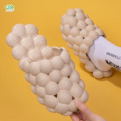 China CUSHIONING Massage Feeling Home Slippers Women Man Fashion Eva Sandals Egg Bubble Slippers Fashionable Cool Popular Poop Feeling Home Slippers for sale