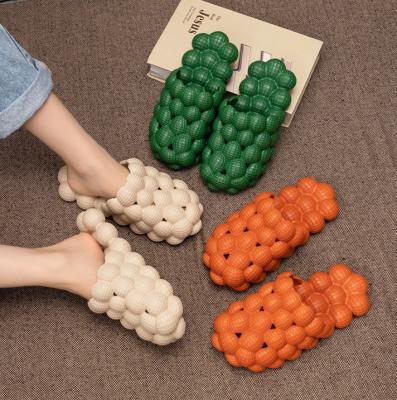 China 35-45 Fashionable Wholesale Anti-skid Orange Bubble Cool Man Women Slippers Eva Shape Shit Feeling Massage Home Slippers for sale