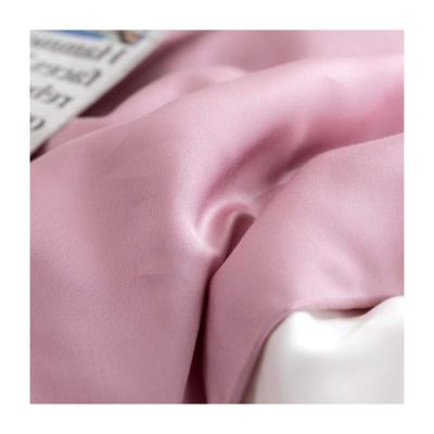 China Textile Material OEM Solid Color Ice Silk Polyester Fabric Shrink-Resistant Home Woven Factory Rose Gold Fabric for sale