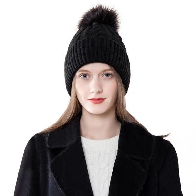 China COMMON Classic outdoor knit cable women's hat with pompom for sale