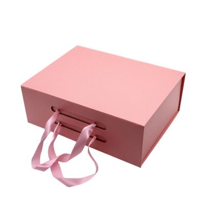 China Recyclable Custom Logo Luxury Cardboard Magnetic Folding Gift Box With Ribbon Closure for sale