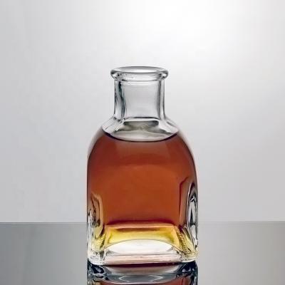 China Luxury Liquor Bottles Empty Minil Spirit Decanter 100ml Small Liquor Bottle With Cork Rum Bottle Glass Top Wholesale Vodka Whiskey For Liquor for sale