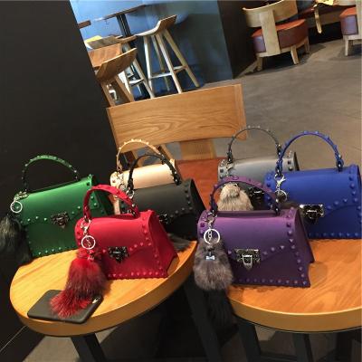 China 2021 Fashion Shape Matte PVC Jelly Bag Trend Color Diamond Riveter Bill of Lading Shoulder Cross - Body Bag For Women for sale