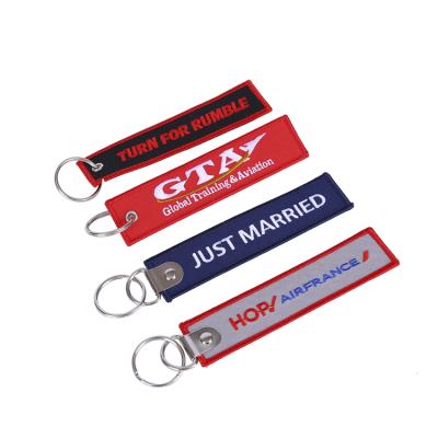 China Custom Fabric\Metal Brand Logo Printed Promotional Embroidery Woven Key Chain for sale