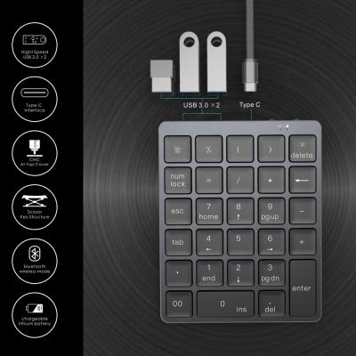 China NEW Scissor Structure Portable Wireless CNC Aluminum Top Cover Slim Ergonomic Numpad Tooth Numpad Numeric Blue Keypad for sale