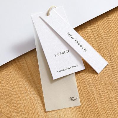 China Other Custom Tag Luxury Hanging Tag With Free Clamps Swing Paper Special Hang Tags For Clothing Garment for sale