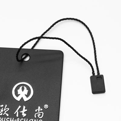 China Sustainable Black Embossing Plastic String Hang Tags String Hangtags Product Labels For Own Logo Apparel for sale