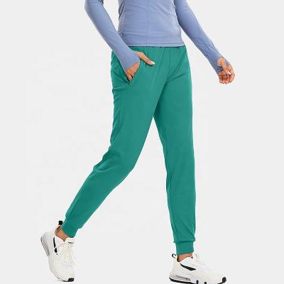 China Gym Fitness Gym Pants Activewear Pants Jogger Sweatpants xxxx Elastic Stylish Girl's Casual Tracksuit With Zippered Pocket for sale