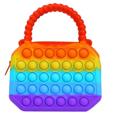 China New Trendy Fashion Kid's Colorful Designer Purses and Handbags Small Girls Toss Shoulder Bag Purse Push Silicone Coin Purses for sale