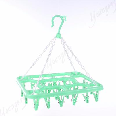 China Large Capacity Clip Hanger Flower Frame Folding Plastic Clothes Airing Hanger Staples Hanger For Underwear for sale