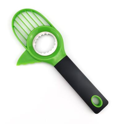 China Kitchen Viable Hot Selling Cheap Instrument Green Color 3 In 1 Tool Fruit Core Remover Avocado Slicer Cutter for sale