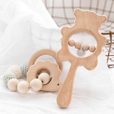 China Europe Gifts Hedgehog Wooden Shape Grasping Shower Wooden Rattles Bracelet Rattle Set Handshake Beech Wooden Educational Bar With Bell for sale