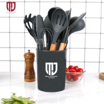 China Sustainable 11 Pcs Silicone Kitchen Utensils Sets Logo Printed Kitchen Wooden Handle Rubber Cookware Sets Kitchenware for sale