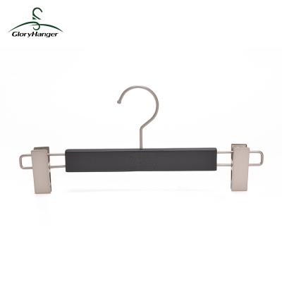 China Anti-Slip Black Luxury Wooden Hanger Swivel Pants Hangers With Clips for sale