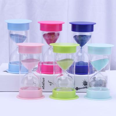 China Minimalist Customize 30 miuntes Large Frame 1 Hour Circular Sand Timer Pink Art Plastic Sand Glass for sale