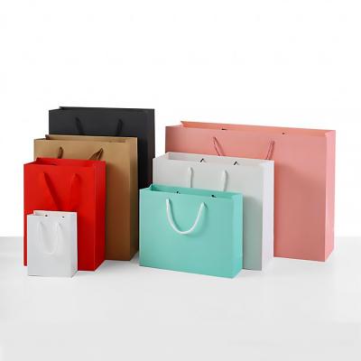 China Wholesale Recyclable Paper Bags Y1 Hot Purchasing Luxury Foiled Stamping Black Paper Bag With Cotton Rope Handles for sale